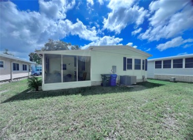 This stunning, partically furnished residence offers an inviting on Fairway Village Golf Course in Florida - for sale on GolfHomes.com, golf home, golf lot