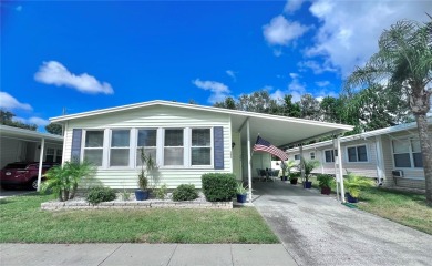 This stunning, partically furnished residence offers an inviting on Fairway Village Golf Course in Florida - for sale on GolfHomes.com, golf home, golf lot