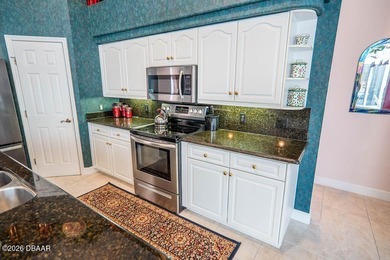 Pride of ownership shines throughout this immaculate well on Plantation Bay Golf and Country Club in Florida - for sale on GolfHomes.com, golf home, golf lot