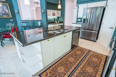 Pride of ownership shines throughout this immaculate well on Plantation Bay Golf and Country Club in Florida - for sale on GolfHomes.com, golf home, golf lot