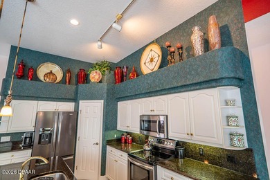 Pride of ownership shines throughout this immaculate well on Plantation Bay Golf and Country Club in Florida - for sale on GolfHomes.com, golf home, golf lot