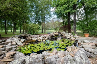 This stunning custom home on the prestigious Founder's Course of on Chenal Country Club - Bear Den Mountain in Arkansas - for sale on GolfHomes.com, golf home, golf lot