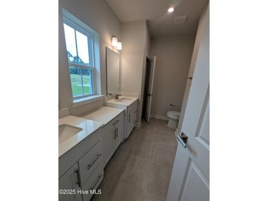 QUICK MOVE IN!! Welcome to Resort Style Living a golf cart ride on Sea Trail Golf Resort in North Carolina - for sale on GolfHomes.com, golf home, golf lot