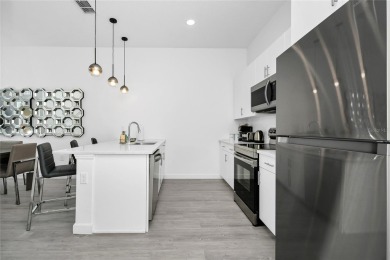This beautifully designed 4-bedroom, 4-bathroom townhouse plus a on Reunion Resort Golf Course in Florida - for sale on GolfHomes.com, golf home, golf lot