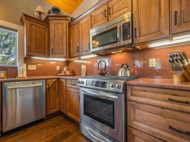 Nestled on an expansive 1.9-acre lot surrounded by whispering on Angel Fire Resort Country Club in New Mexico - for sale on GolfHomes.com, golf home, golf lot