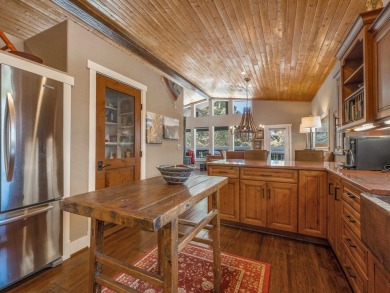Nestled on an expansive 1.9-acre lot surrounded by whispering on Angel Fire Resort Country Club in New Mexico - for sale on GolfHomes.com, golf home, golf lot