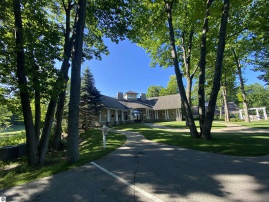 Surround yourself among nature and endless recreation on Manitou Passage Golf Club in Michigan - for sale on GolfHomes.com, golf home, golf lot