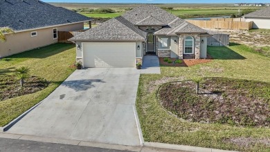 This exquisite SPI Golf Community property backs up to the on South Padre Island Golf Club in Texas - for sale on GolfHomes.com, golf home, golf lot