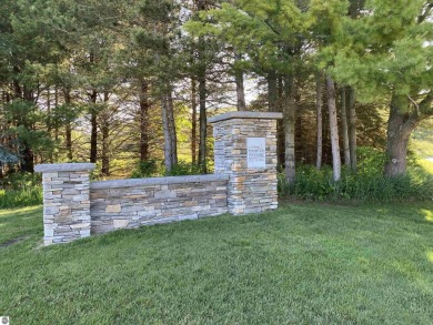 Surround yourself among nature and endless recreation on Manitou Passage Golf Club in Michigan - for sale on GolfHomes.com, golf home, golf lot