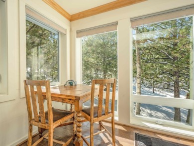 Nestled on an expansive 1.9-acre lot surrounded by whispering on Angel Fire Resort Country Club in New Mexico - for sale on GolfHomes.com, golf home, golf lot
