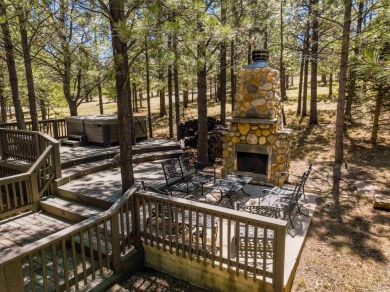 Nestled on an expansive 1.9-acre lot surrounded by whispering on Angel Fire Resort Country Club in New Mexico - for sale on GolfHomes.com, golf home, golf lot