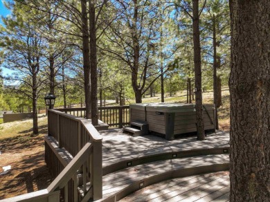 Nestled on an expansive 1.9-acre lot surrounded by whispering on Angel Fire Resort Country Club in New Mexico - for sale on GolfHomes.com, golf home, golf lot