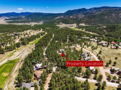 Nestled on an expansive 1.9-acre lot surrounded by whispering on Angel Fire Resort Country Club in New Mexico - for sale on GolfHomes.com, golf home, golf lot