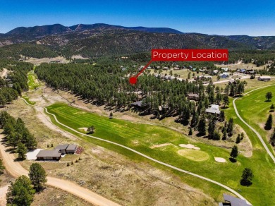 Nestled on an expansive 1.9-acre lot surrounded by whispering on Angel Fire Resort Country Club in New Mexico - for sale on GolfHomes.com, golf home, golf lot