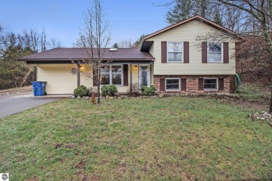 Discover comfort and convenience in this well-maintained on Bear Lake Highlands Golf Course in Michigan - for sale on GolfHomes.com, golf home, golf lot