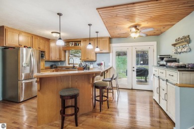 Discover comfort and convenience in this well-maintained on Bear Lake Highlands Golf Course in Michigan - for sale on GolfHomes.com, golf home, golf lot