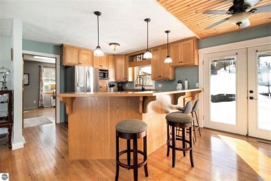 Discover comfort and convenience in this well-maintained on Bear Lake Highlands Golf Course in Michigan - for sale on GolfHomes.com, golf home, golf lot