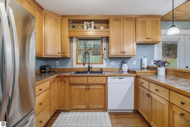 Discover comfort and convenience in this well-maintained on Bear Lake Highlands Golf Course in Michigan - for sale on GolfHomes.com, golf home, golf lot