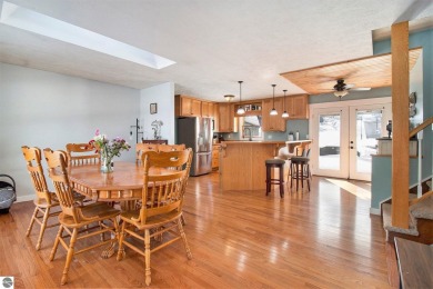 Discover comfort and convenience in this well-maintained on Bear Lake Highlands Golf Course in Michigan - for sale on GolfHomes.com, golf home, golf lot