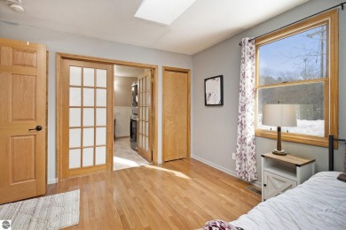 Discover comfort and convenience in this well-maintained on Bear Lake Highlands Golf Course in Michigan - for sale on GolfHomes.com, golf home, golf lot