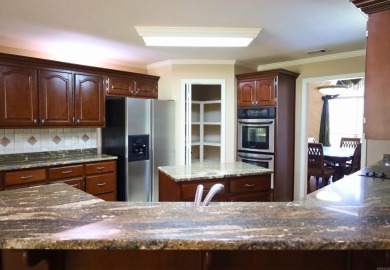 Experience the epitome of luxury in this stunning 4-bedroom, 2 on Paragould Country Club in Arkansas - for sale on GolfHomes.com, golf home, golf lot