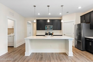 Welcome to a home where timeless elegance meets modern ease--The on Cape Fear National At Brunswick Forest in North Carolina - for sale on GolfHomes.com, golf home, golf lot