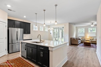 Welcome to a home where timeless elegance meets modern ease--The on Cape Fear National At Brunswick Forest in North Carolina - for sale on GolfHomes.com, golf home, golf lot