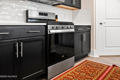 Welcome to a home where timeless elegance meets modern ease--The on Cape Fear National At Brunswick Forest in North Carolina - for sale on GolfHomes.com, golf home, golf lot