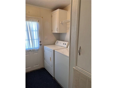 Welcome to resort-style living at Golf Lakes Residents Co-Op, a on Heather Hills Golf Course in Florida - for sale on GolfHomes.com, golf home, golf lot