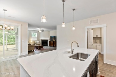 Welcome to a home where timeless elegance meets modern ease--The on Cape Fear National At Brunswick Forest in North Carolina - for sale on GolfHomes.com, golf home, golf lot