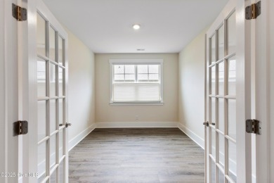 Welcome to a home where timeless elegance meets modern ease--The on Cape Fear National At Brunswick Forest in North Carolina - for sale on GolfHomes.com, golf home, golf lot