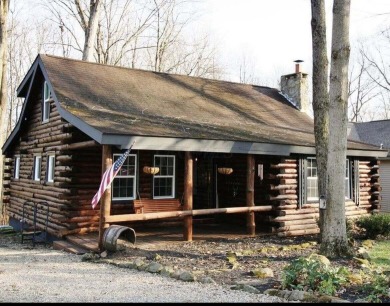 Welcome to this authentic Cape Cod-style log cabin in the heart on Apple Valley Golf Course in Ohio - for sale on GolfHomes.com, golf home, golf lot