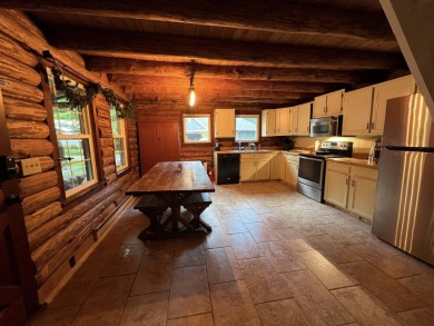 Welcome to this authentic Cape Cod-style log cabin in the heart on Apple Valley Golf Course in Ohio - for sale on GolfHomes.com, golf home, golf lot