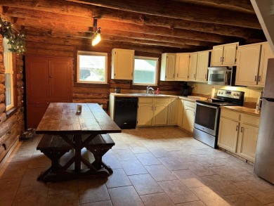 Welcome to this authentic Cape Cod-style log cabin in the heart on Apple Valley Golf Course in Ohio - for sale on GolfHomes.com, golf home, golf lot