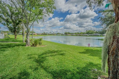 PICTURE PERFECT and perched on a large, serene POND, this on Tampa Bay Golf and Country Club in Florida - for sale on GolfHomes.com, golf home, golf lot