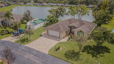 PICTURE PERFECT and perched on a large, serene POND, this on Tampa Bay Golf and Country Club in Florida - for sale on GolfHomes.com, golf home, golf lot