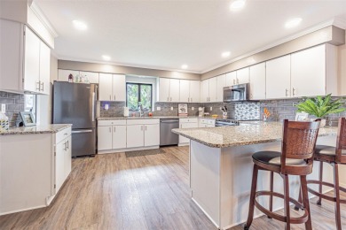 PICTURE PERFECT and perched on a large, serene POND, this on Tampa Bay Golf and Country Club in Florida - for sale on GolfHomes.com, golf home, golf lot
