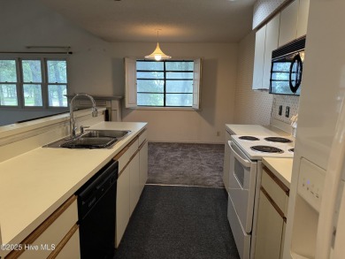 A 4-bedroom Club Villa is now available within Sea Trail on Sea Trail Golf Resort in North Carolina - for sale on GolfHomes.com, golf home, golf lot