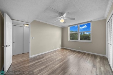 Experience the best of Florida living in this stunning home on Palm-Aire Country Club and Resort - Palms in Florida - for sale on GolfHomes.com, golf home, golf lot