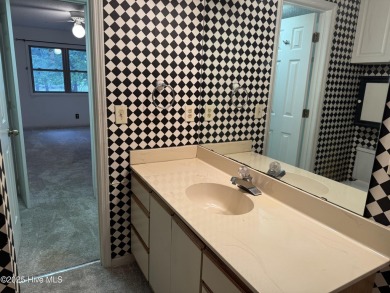 A 4-bedroom Club Villa is now available within Sea Trail on Sea Trail Golf Resort in North Carolina - for sale on GolfHomes.com, golf home, golf lot