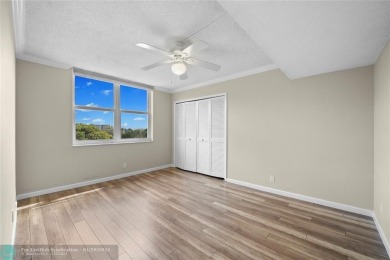 Experience the best of Florida living in this stunning home on Palm-Aire Country Club and Resort - Palms in Florida - for sale on GolfHomes.com, golf home, golf lot