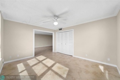 Experience the best of Florida living in this stunning home on Palm-Aire Country Club and Resort - Palms in Florida - for sale on GolfHomes.com, golf home, golf lot