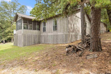 Welcome to your turn-key retreat in the heart of East Texas! on Holly Lake Ranch Golf Club in Texas - for sale on GolfHomes.com, golf home, golf lot