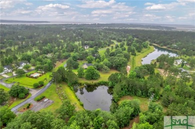 Welcome to the exclusive gated community of Coopers Point, where on Sapelo Hammock Golf Club in Georgia - for sale on GolfHomes.com, golf home, golf lot