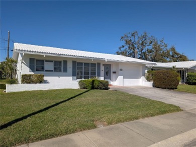 Under contract-accepting backup offers. FRESHLY PAINTED 2/11/25! on Mainlands Golf Club in Florida - for sale on GolfHomes.com, golf home, golf lot