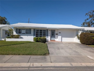 Under contract-accepting backup offers. FRESHLY PAINTED 2/11/25! on Mainlands Golf Club in Florida - for sale on GolfHomes.com, golf home, golf lot