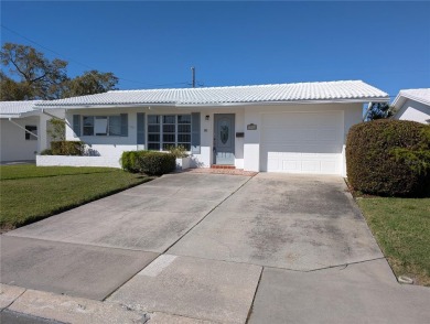 Under contract-accepting backup offers. FRESHLY PAINTED 2/11/25! on Mainlands Golf Club in Florida - for sale on GolfHomes.com, golf home, golf lot