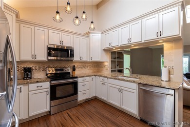 Located in the iconic Tan Tar A Estates, just steps from on The Oaks Golf Course in Missouri - for sale on GolfHomes.com, golf home, golf lot