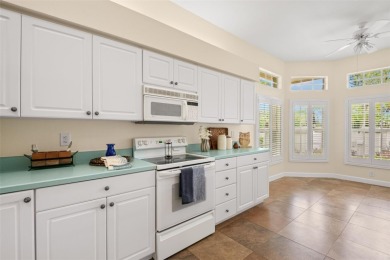 Walk up as you take in the lush landscape and brick paved front on East Lake Woodlands Country Club in Florida - for sale on GolfHomes.com, golf home, golf lot