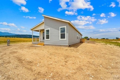 Experience modern country living with breathtaking mountain on Hollydot Golf Course in Colorado - for sale on GolfHomes.com, golf home, golf lot